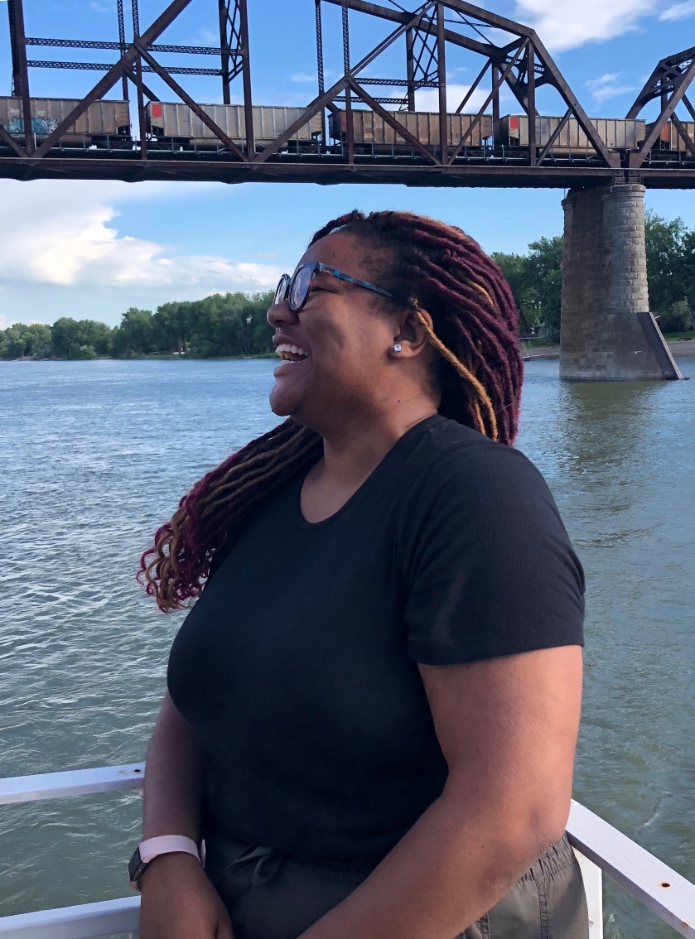 Drey laughing while on a boat in North Dakota.