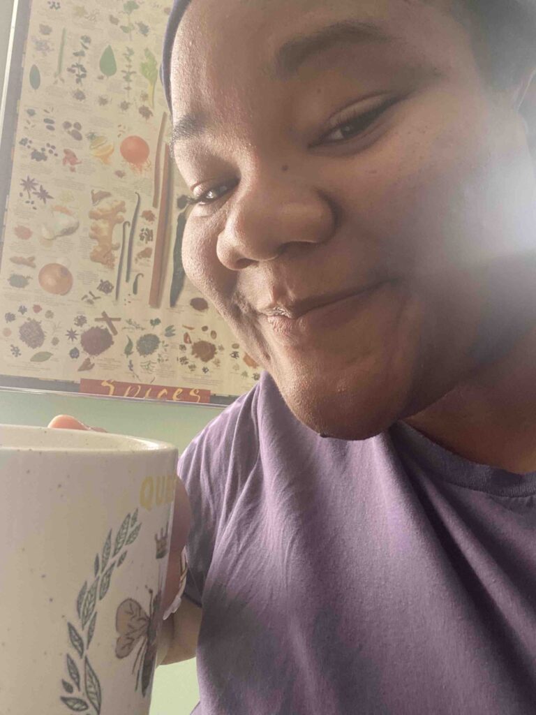 Drey with a gifted mug of tea.